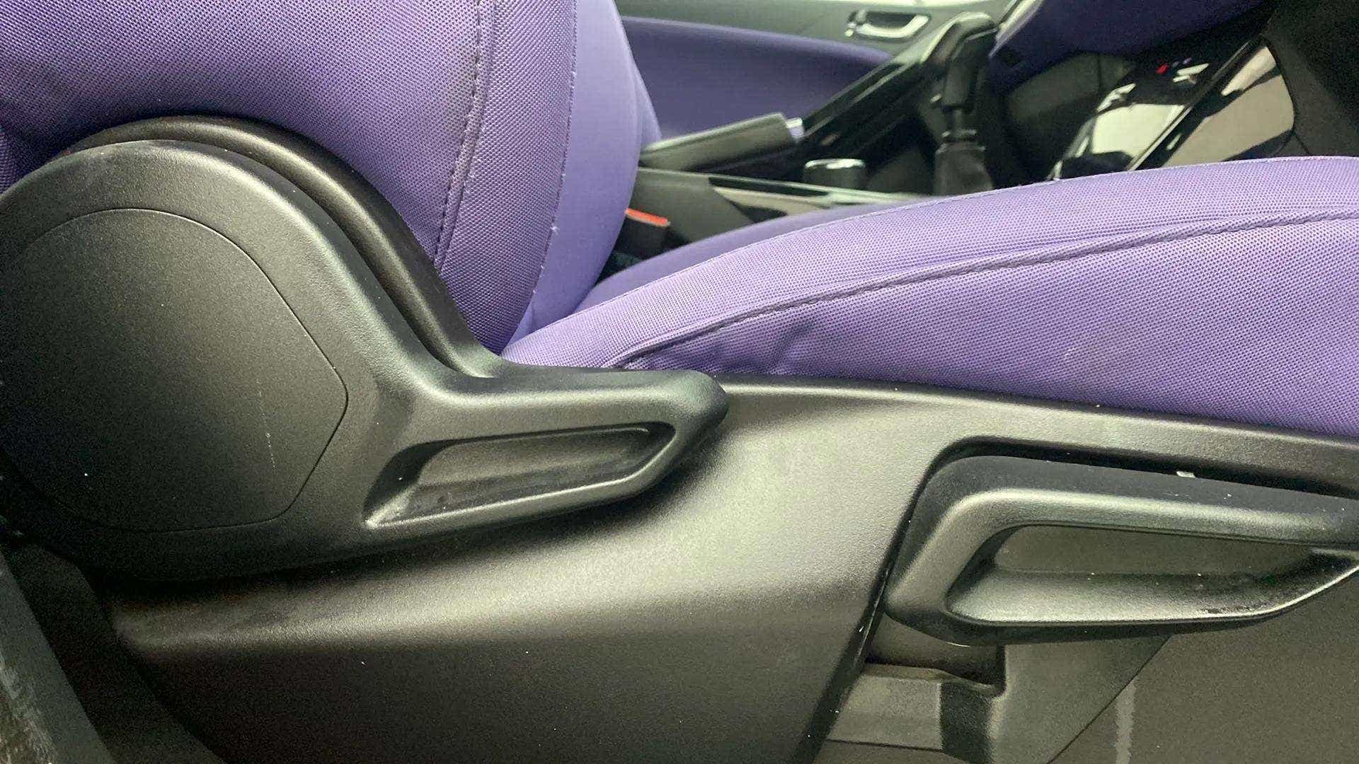 Close-up of the front seat adjustment lever of a Tata Nexon 2017-2023