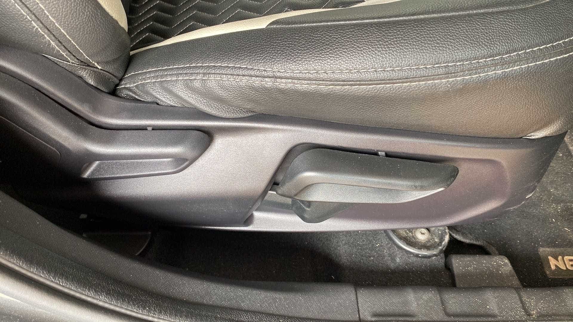 Close-up of the seat adjustment lever of a Tata Nexon 2017-2023