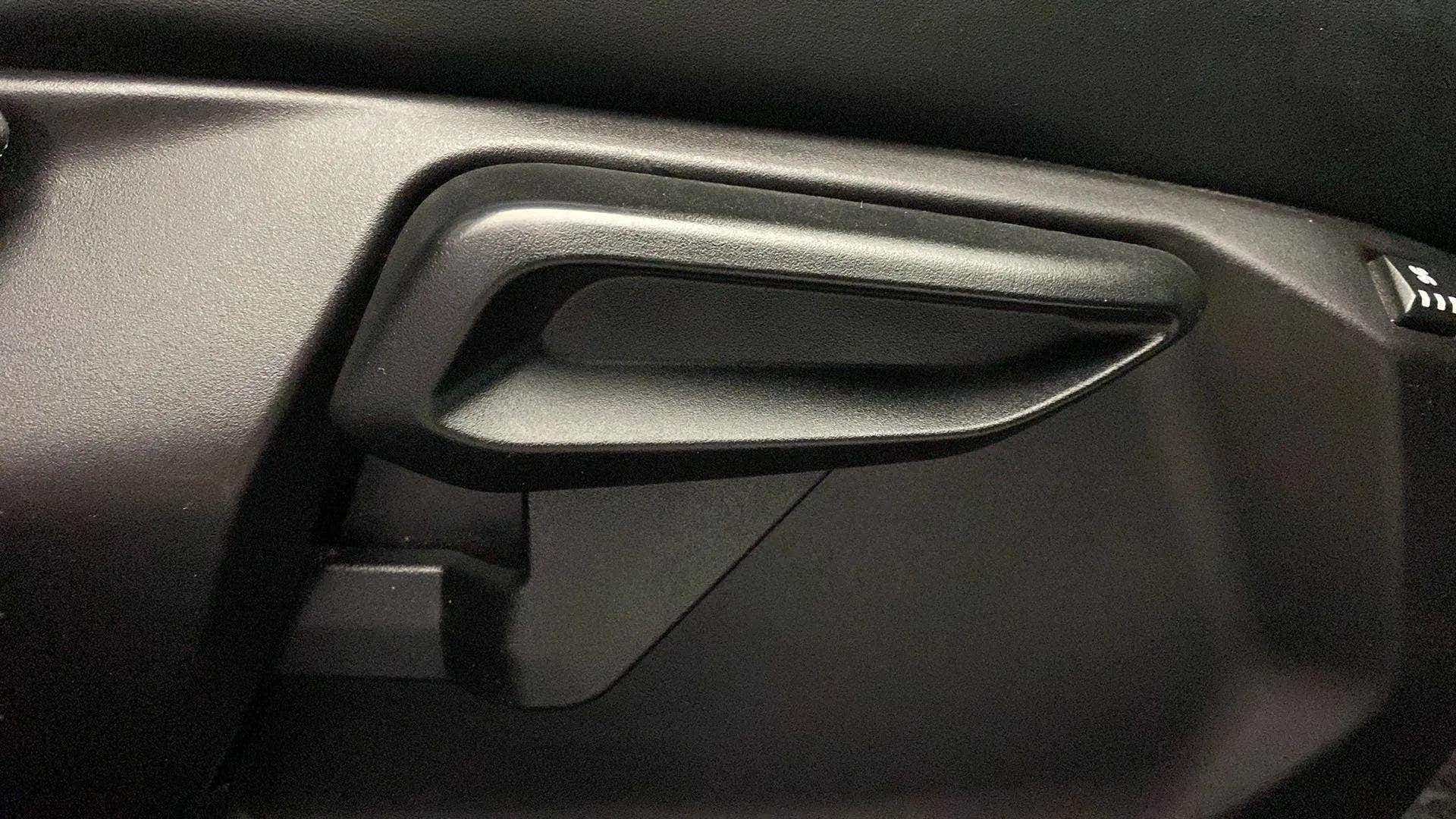 Close-up of a door handle of a Tata Nexon 2017-2023
