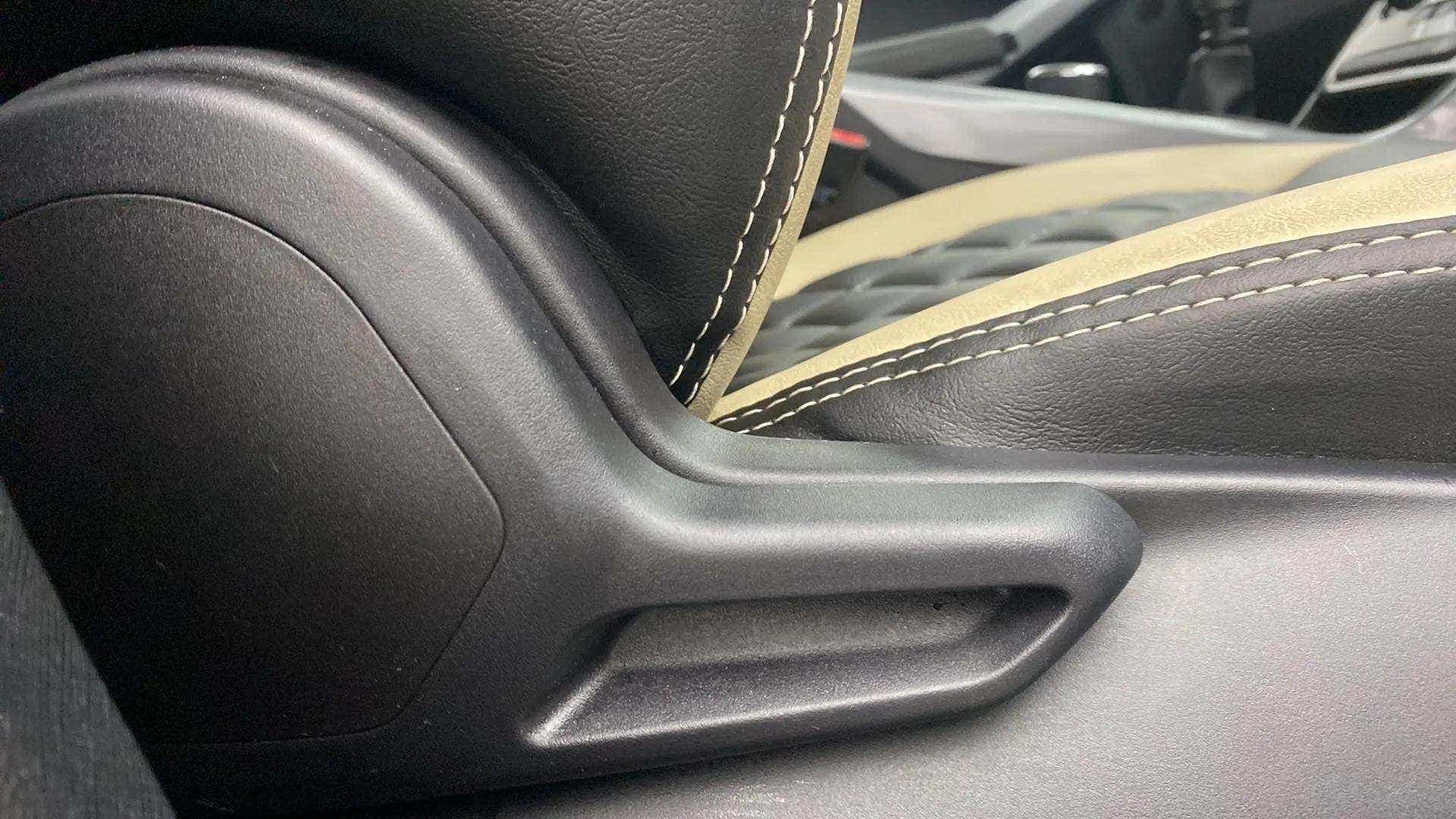 Close-up of seat recline lever and upholstery of a Tata Nexon 2017-2023