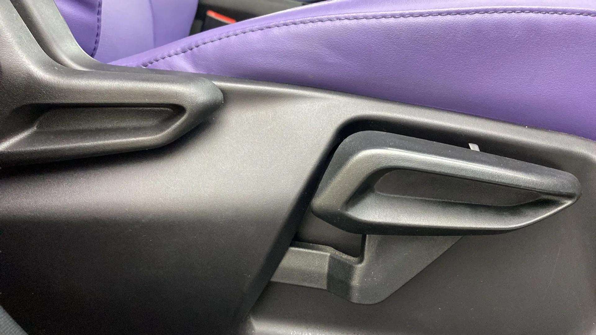 Close-up of a seat adjustment lever in a Tata Nexon 2017-2023