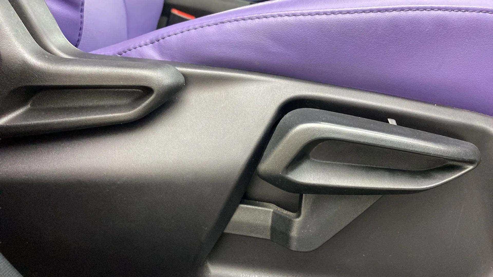 Close-up of a seat adjustment lever in a Tata Nexon 2017-2023