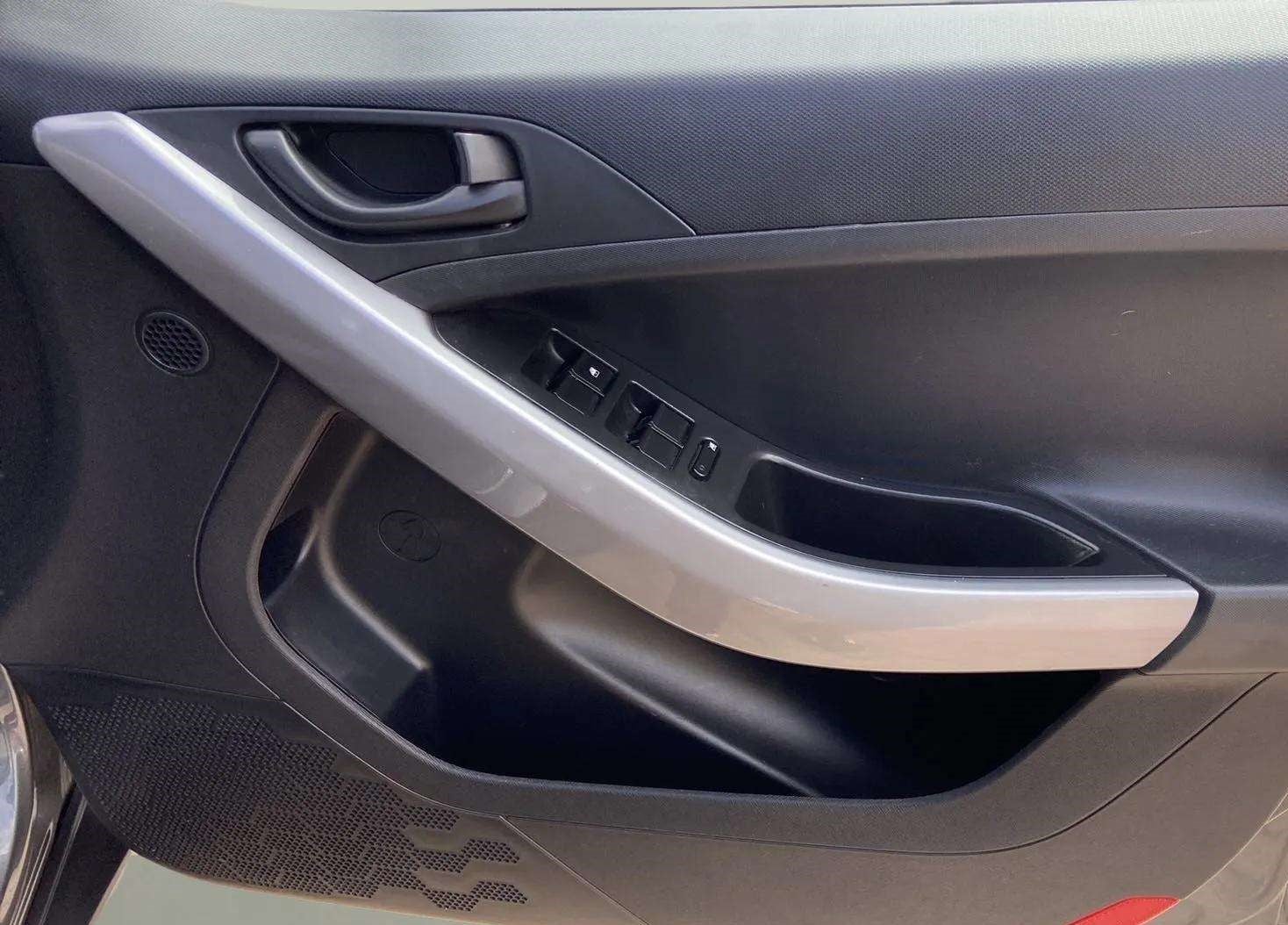 Interior driver-side door panel of a Tata Nexon 2017-2023