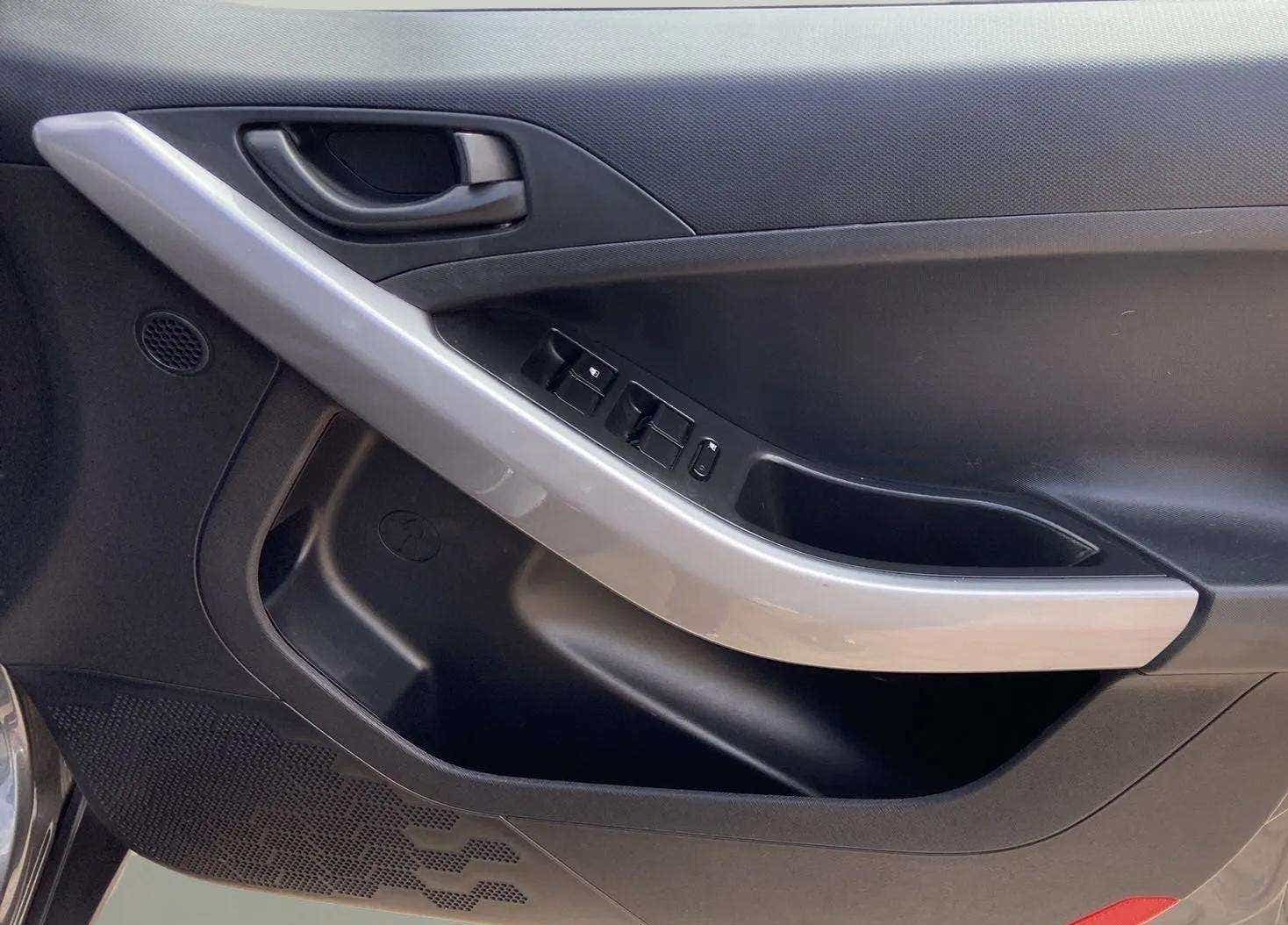 Interior driver-side door panel of a Tata Nexon 2017-2023