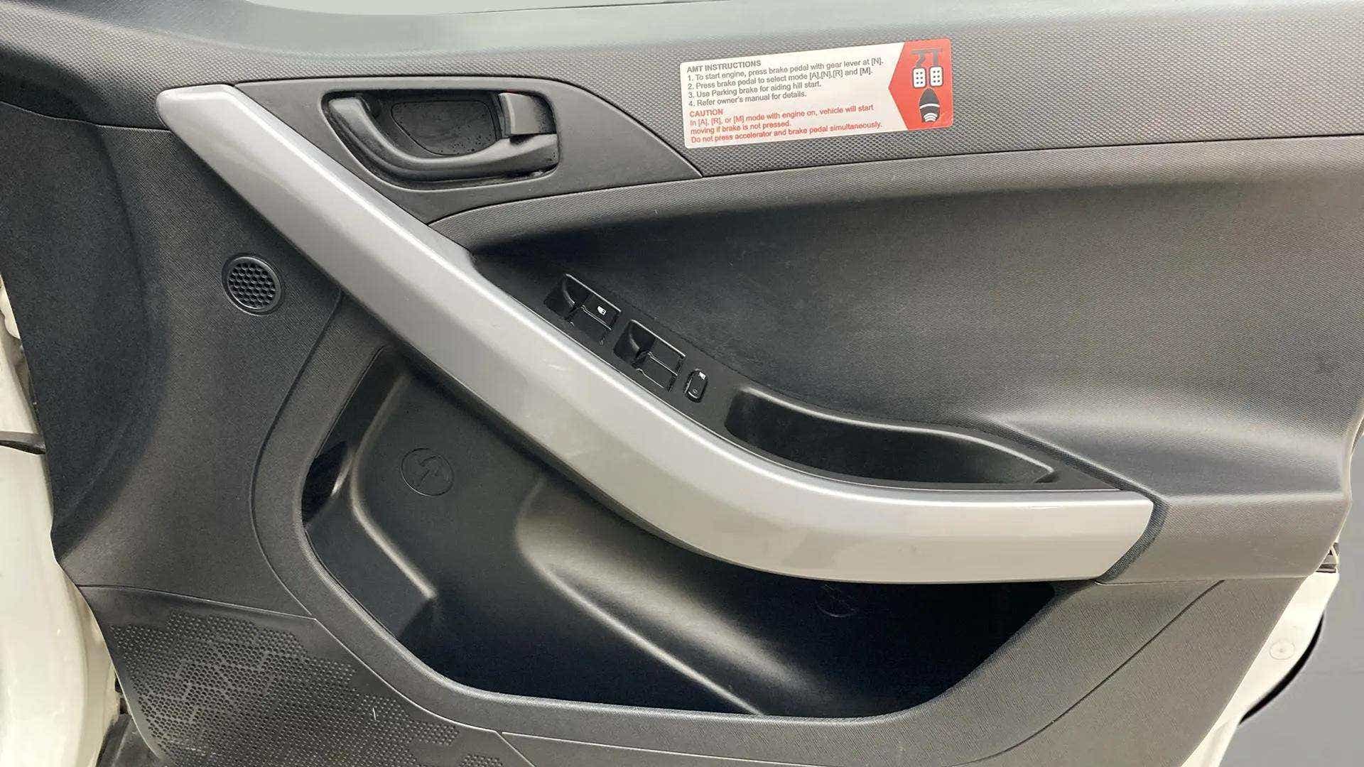 Interior front door panel of a Tata Nexon 2017-2023