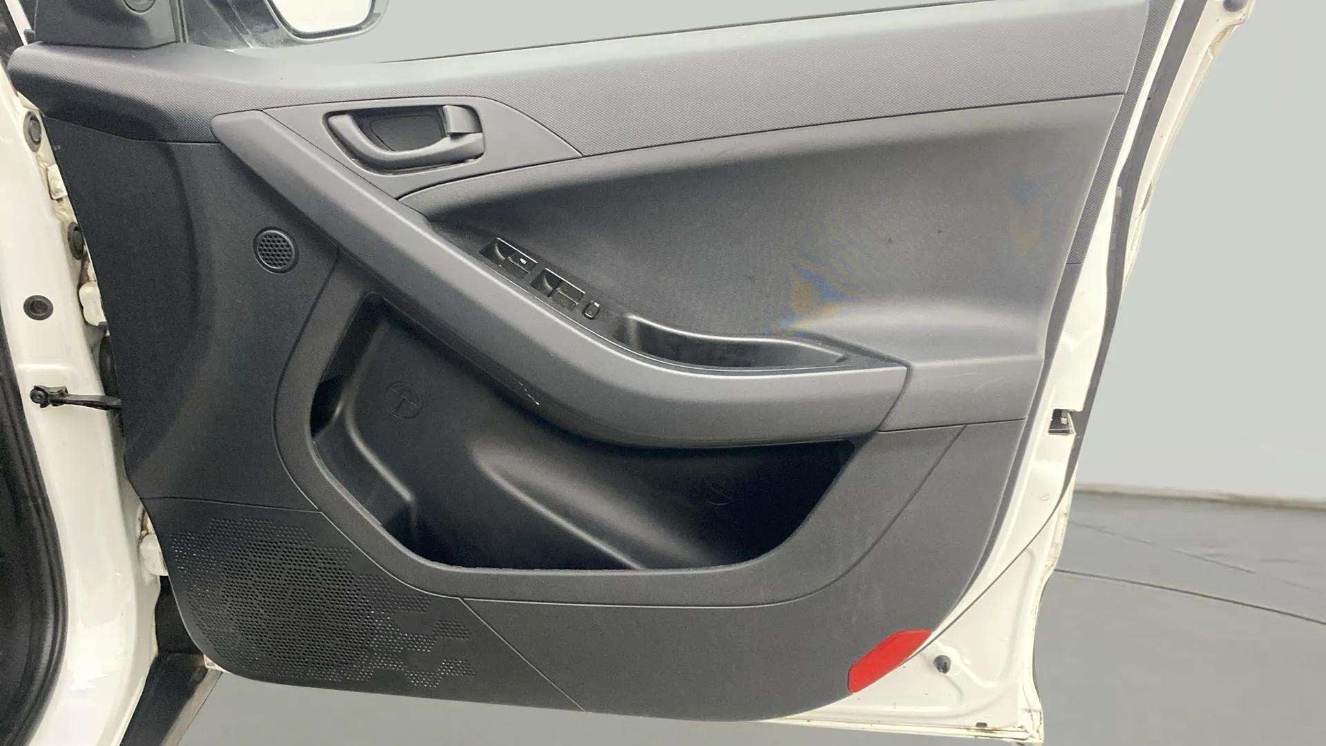 Driver side interior door panel of a Tata Nexon