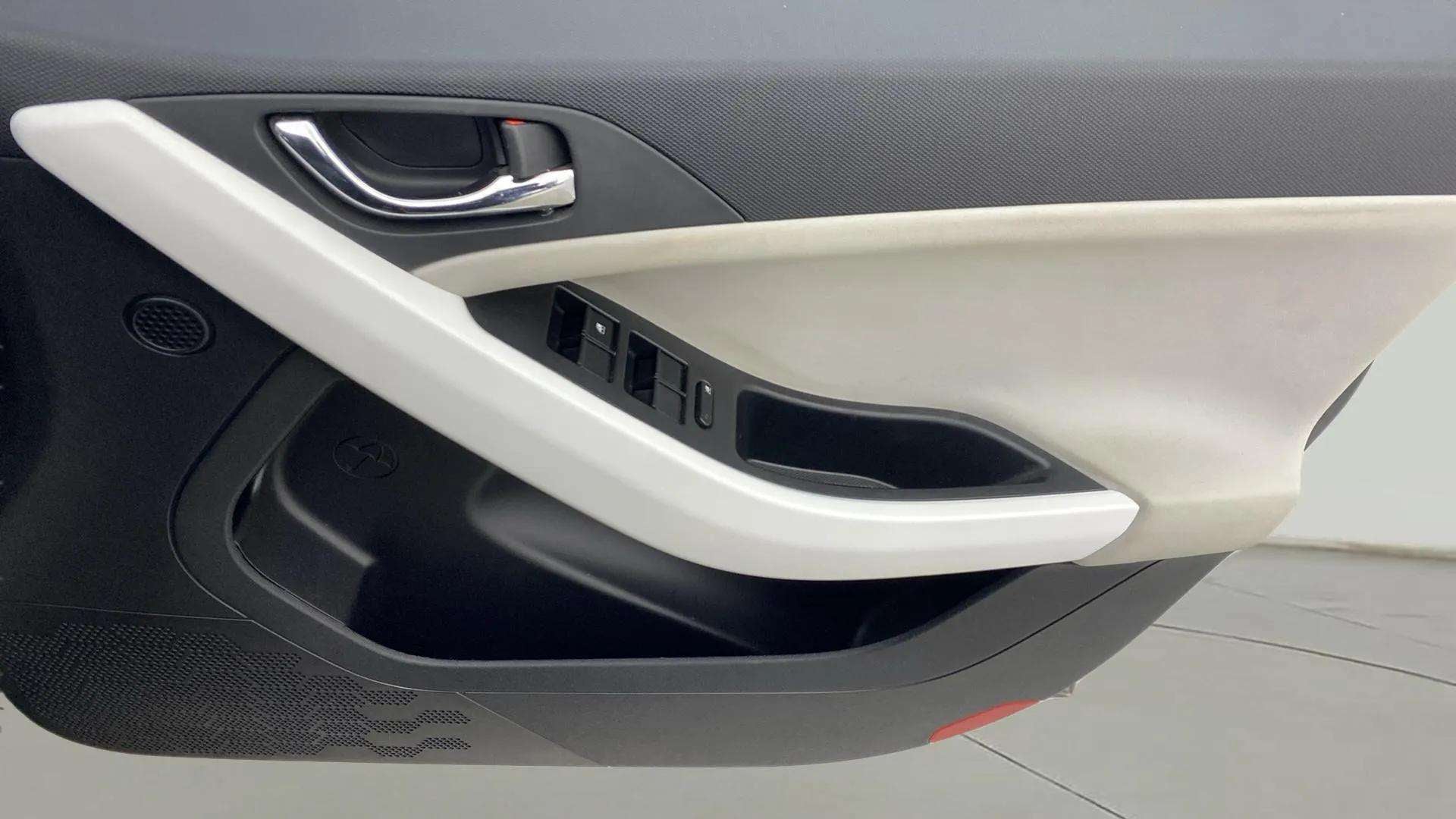 Close-up of front door panel and controls of a Tata Nexon