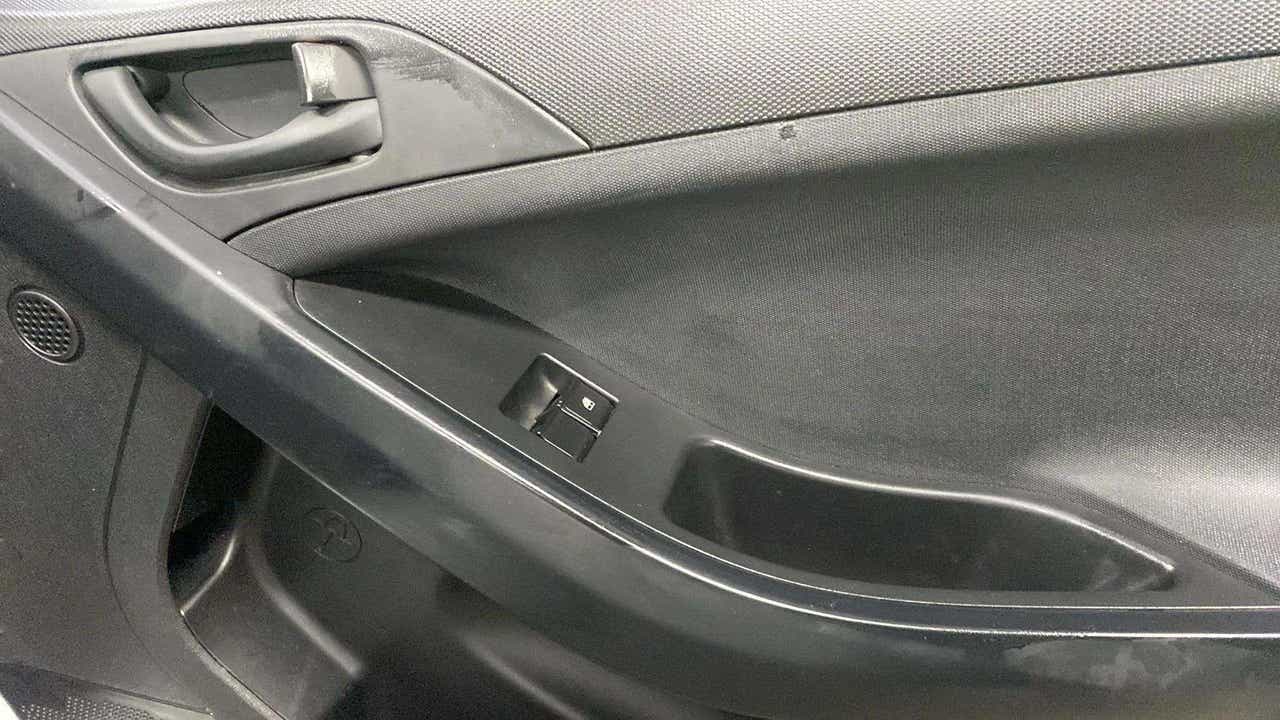Interior driver side door panel of a Tata Nexon
