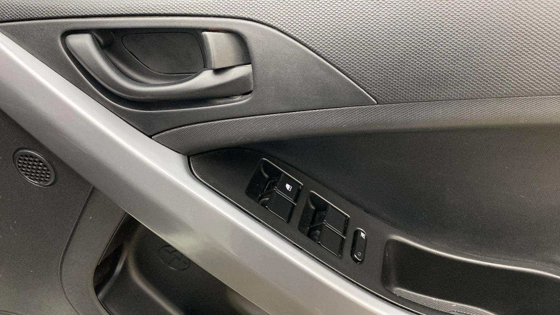 Interior driver-side door panel of a Tata Nexon 2017-2023
