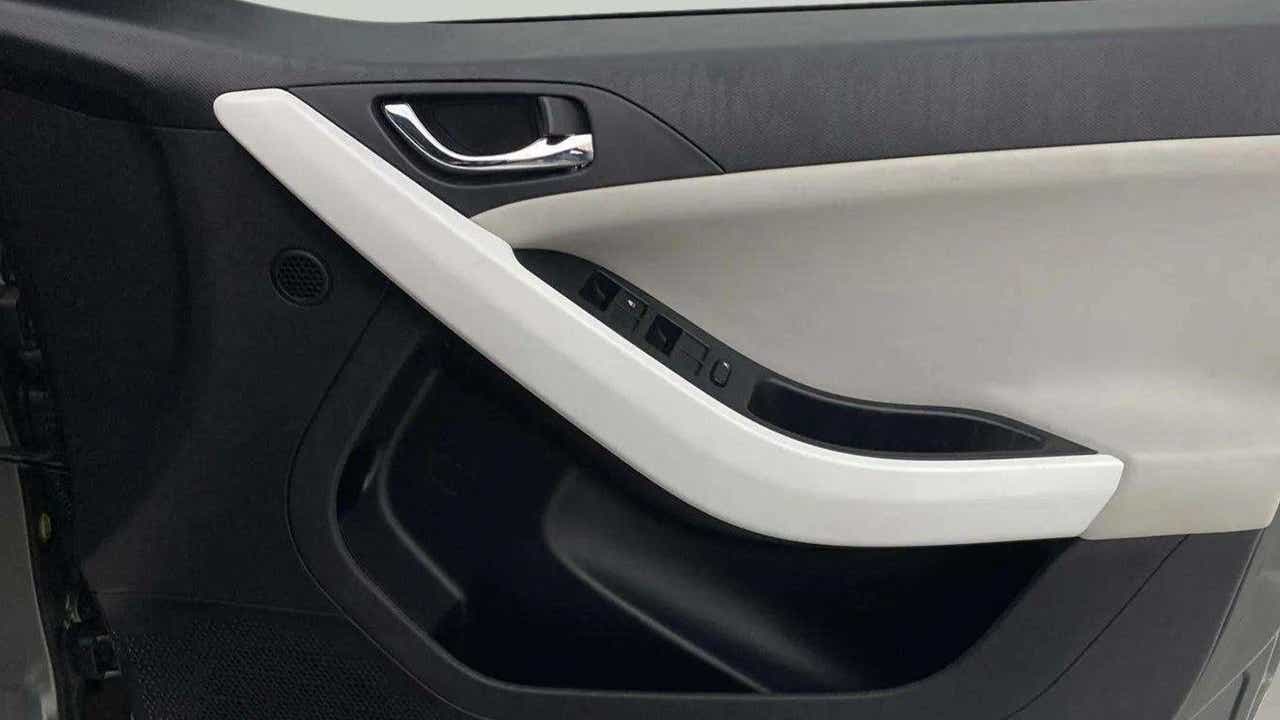 Close-up of the interior door panel of a Tata Nexon