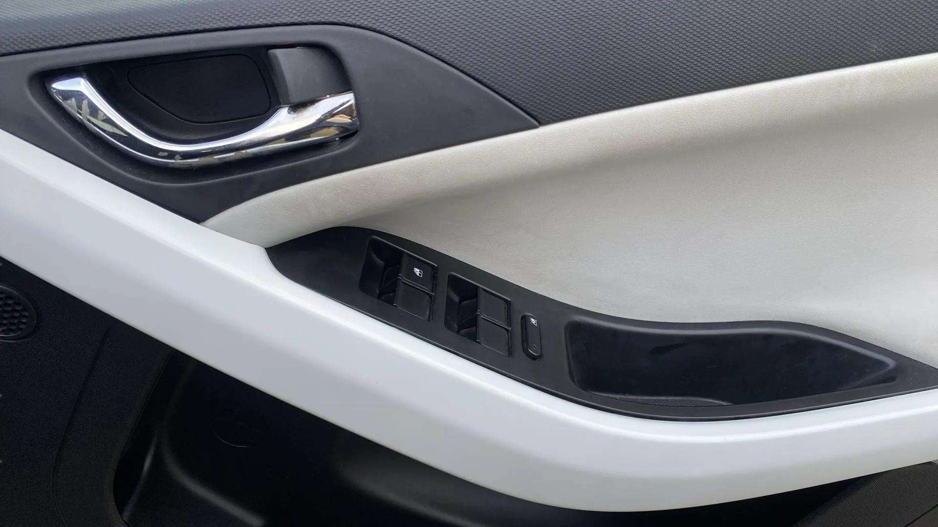 Interior door panel and controls of a Tata Nexon