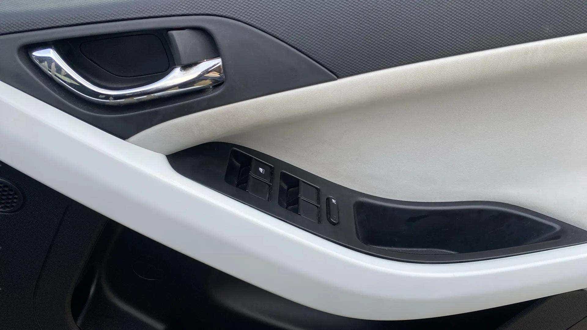 Interior door panel and controls of a Tata Nexon