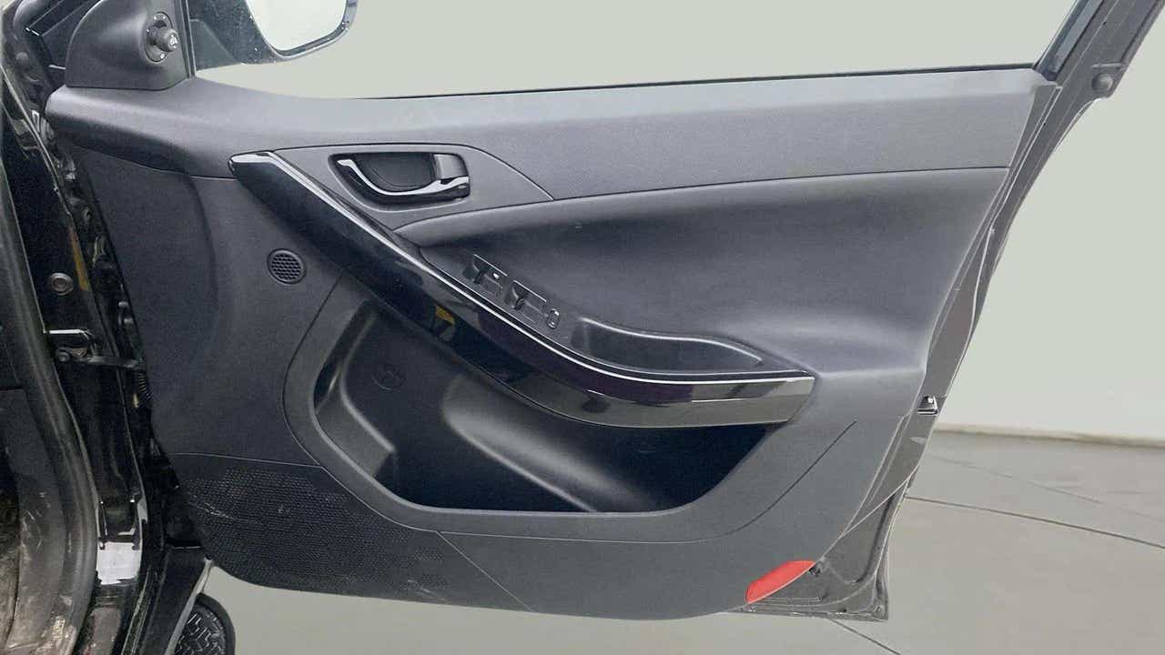 Interior driver door panel of a Tata Nexon