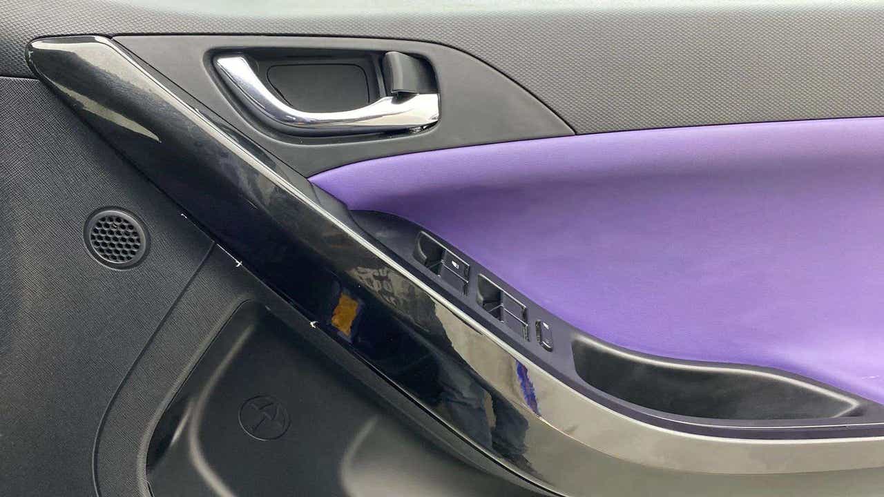 Interior driver side door panel of a Tata Nexon 2017-2023