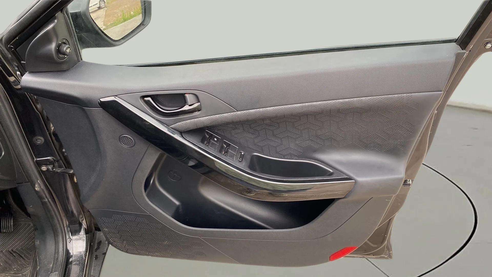Interior driver door panel of a Tata Nexon 2017-2023