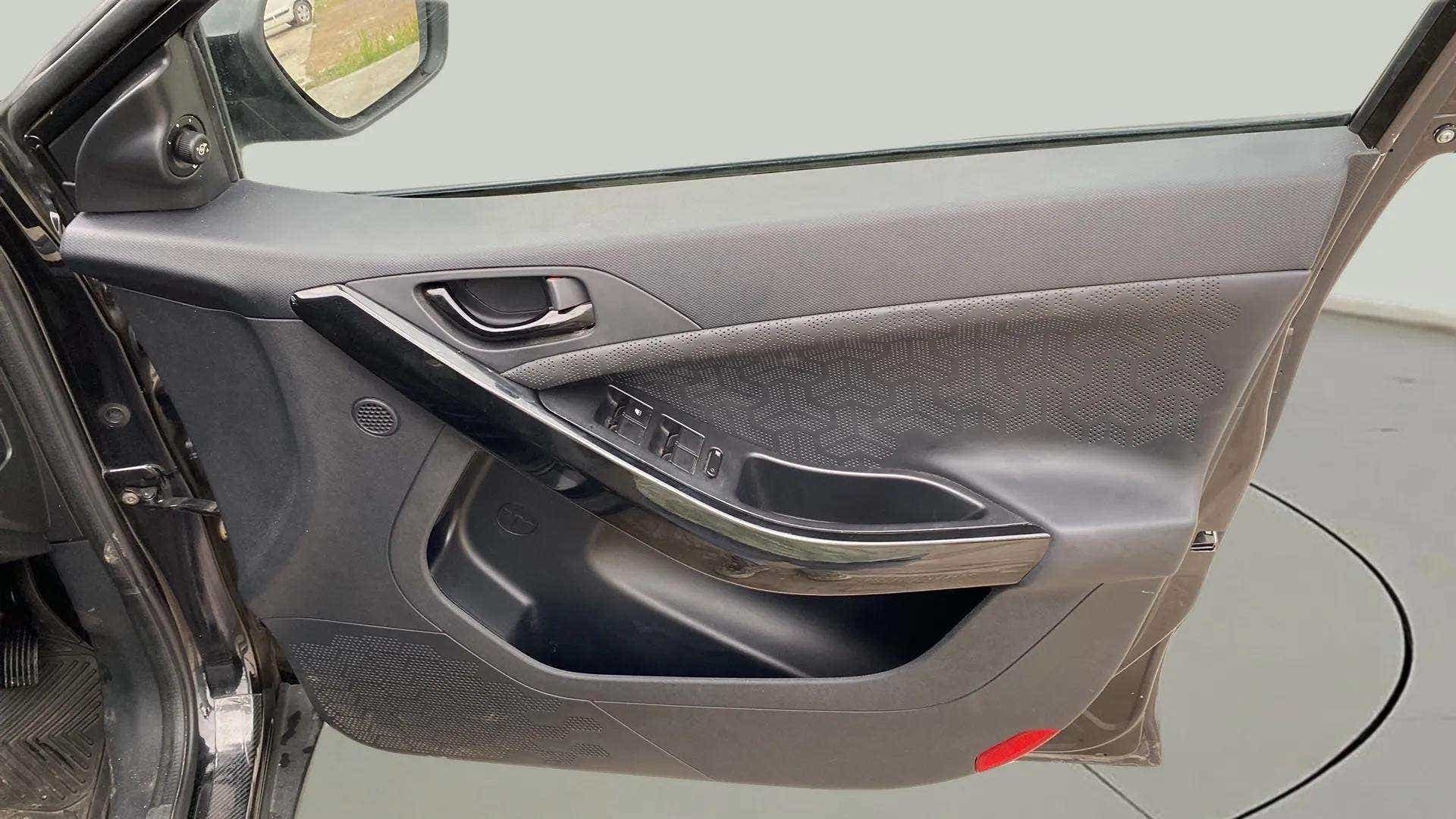 Interior driver door panel of a Tata Nexon 2017-2023