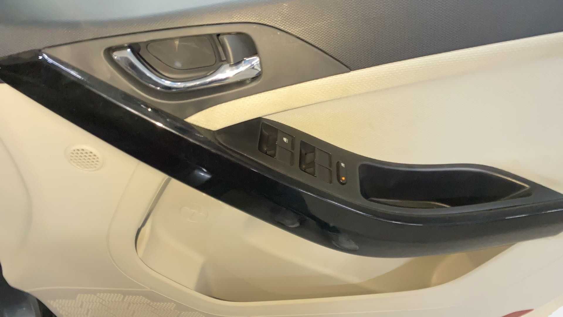 Close-up of the interior door panel and controls of a Tata Nexon 2017-2023