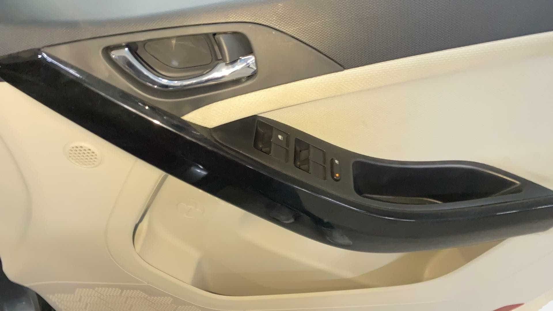 Close-up of the interior door panel and controls of a Tata Nexon 2017-2023