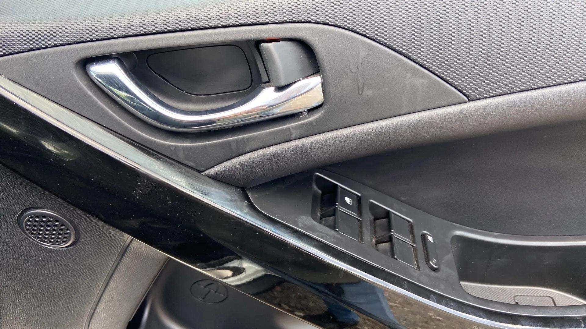 Interior door handle and controls of a Tata Nexon