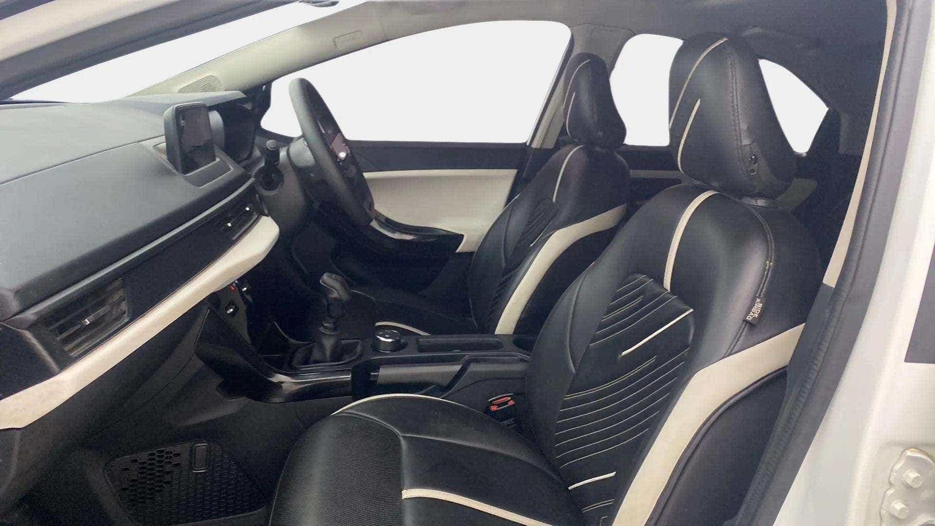 Interior front seats and dashboard of a Tata Nexon 2017-2023
