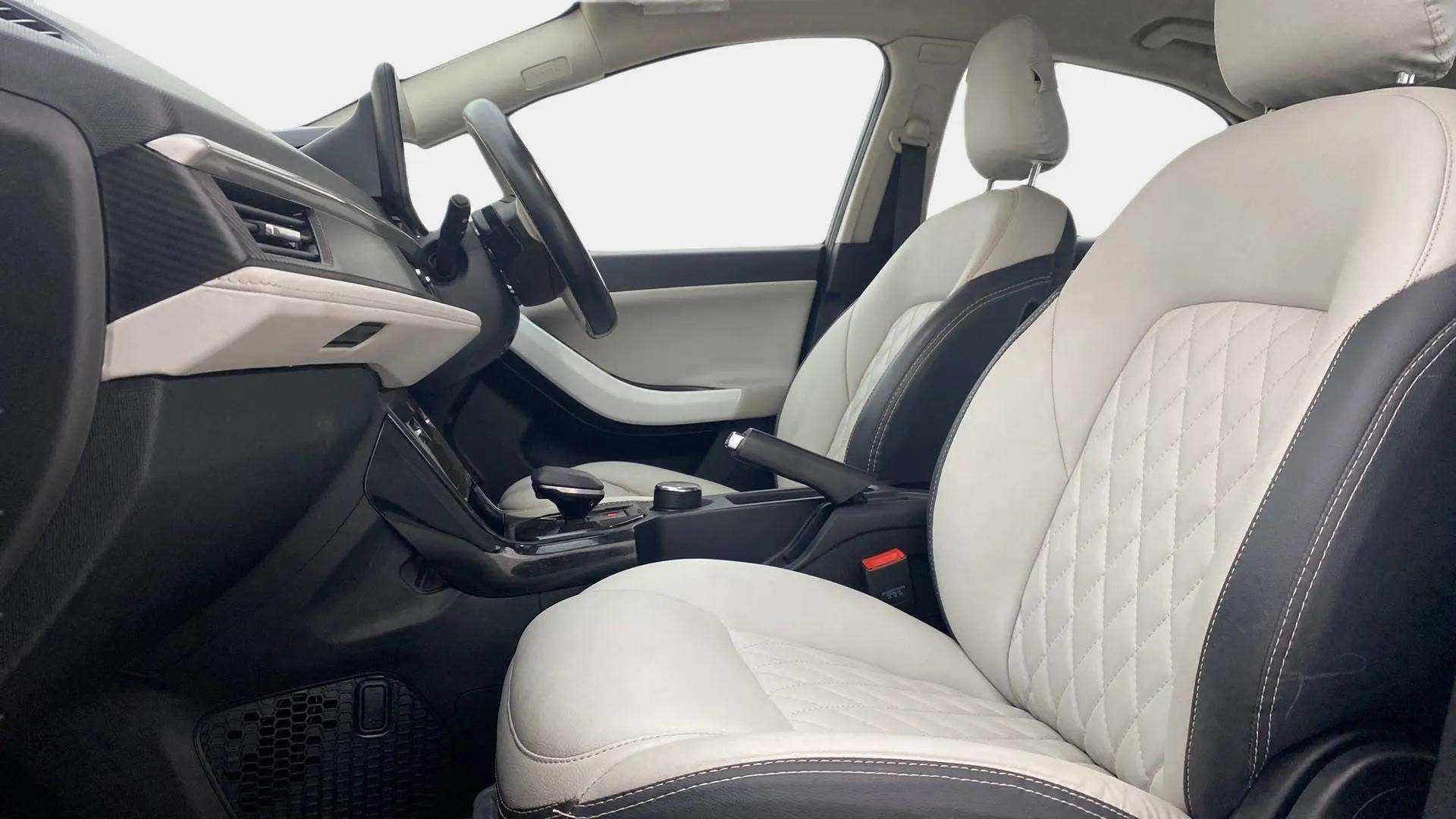 Interior front seats and dashboard of a Tata Nexon 2017-2023