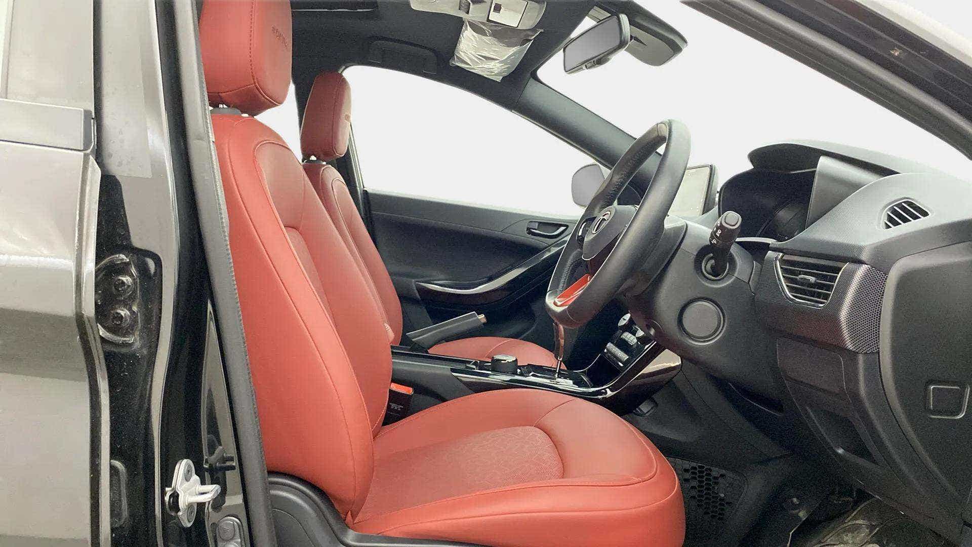 Interior front seat and dashboard view of a Tata Nexon 2017-2023