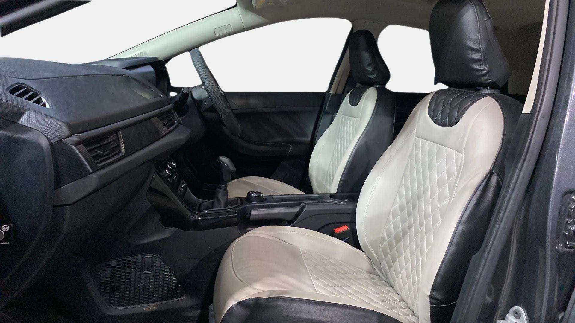 Interior front seats and dashboard of a Tata Nexon