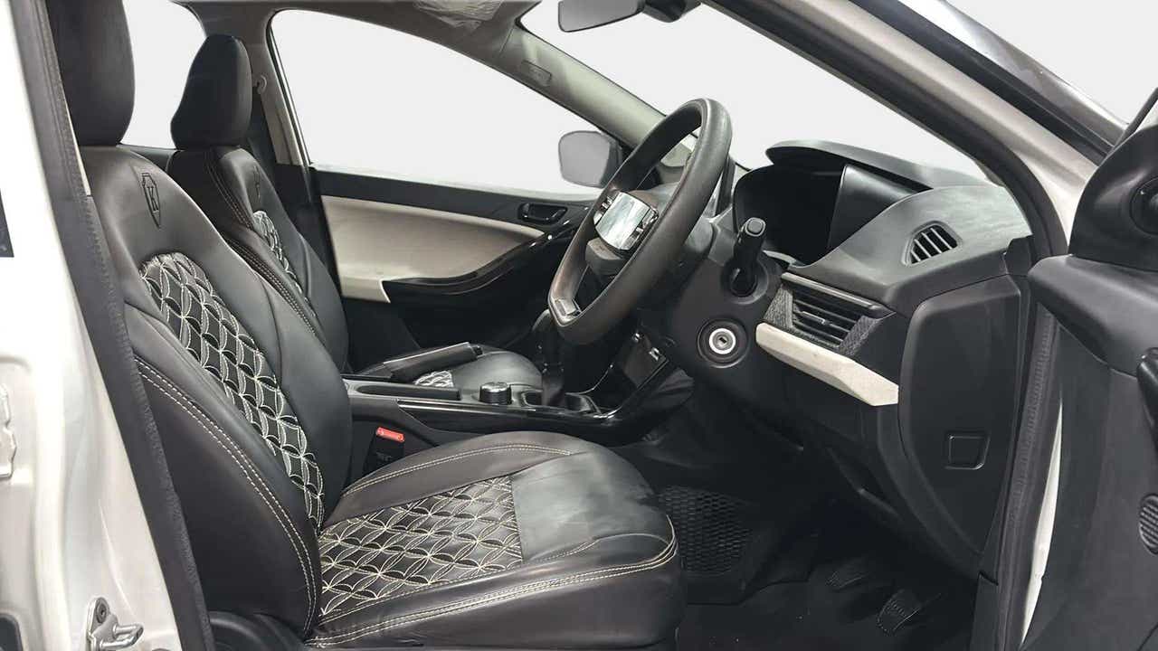Front interior seats and dashboard of a Tata Nexon