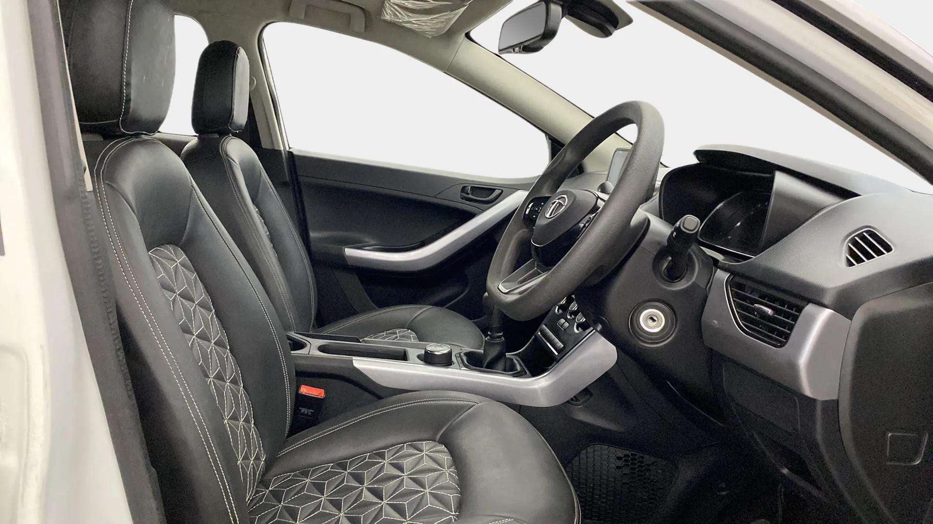 Interior dashboard and front seats of a Tata Nexon 2017-2023