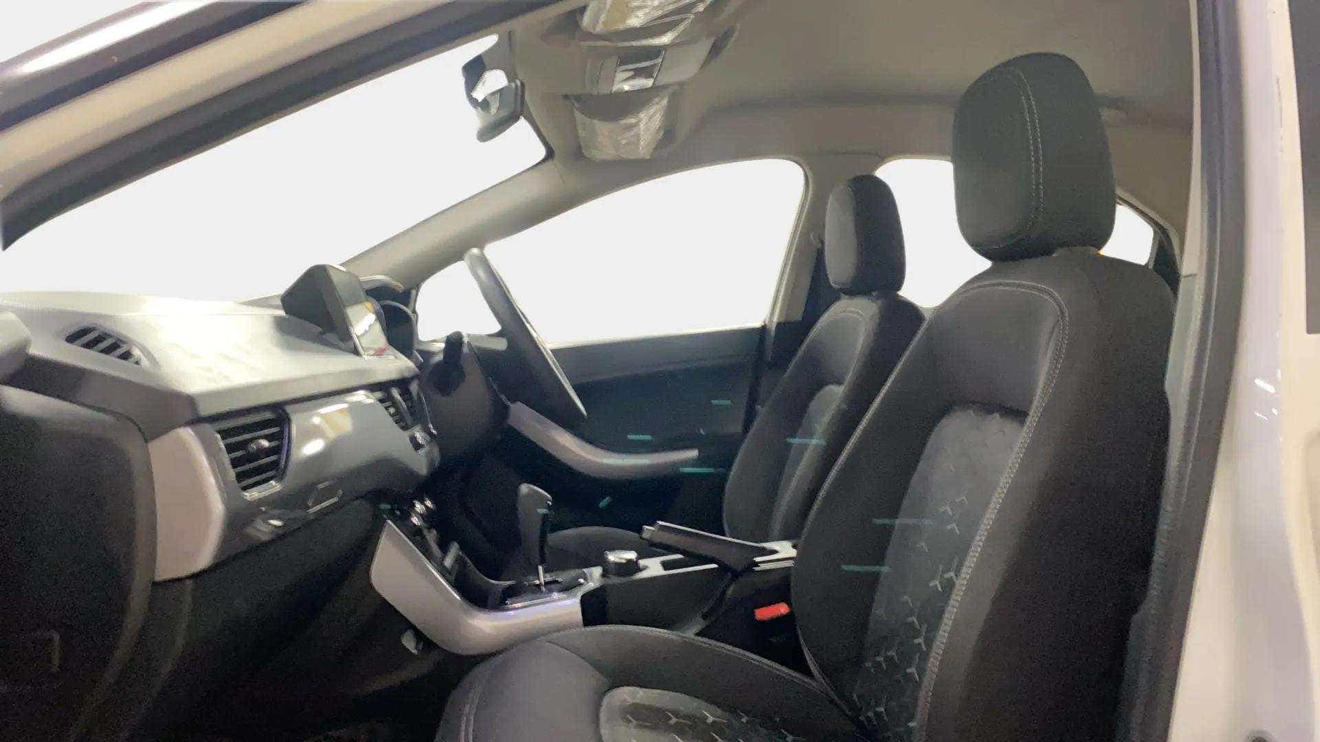 Interior front seats and dashboard of a Tata Nexon 2017-2023
