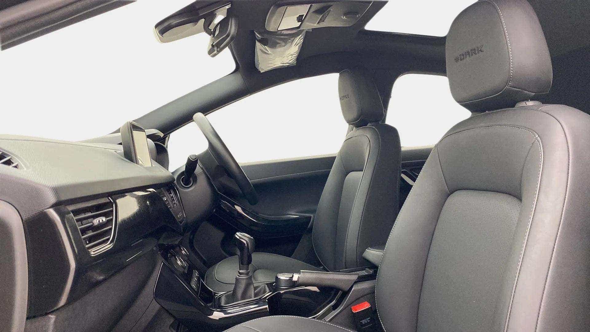 Interior front seats and dashboard of a Tata Nexon 2017-2023