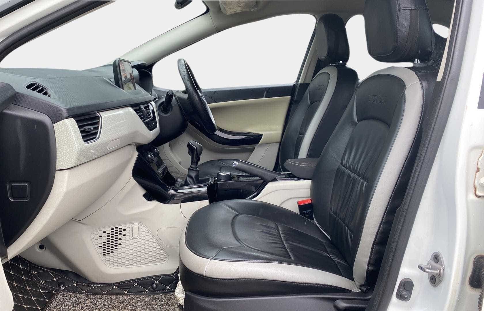 Interior front seats and dashboard of a Tata Nexon 2017-2023