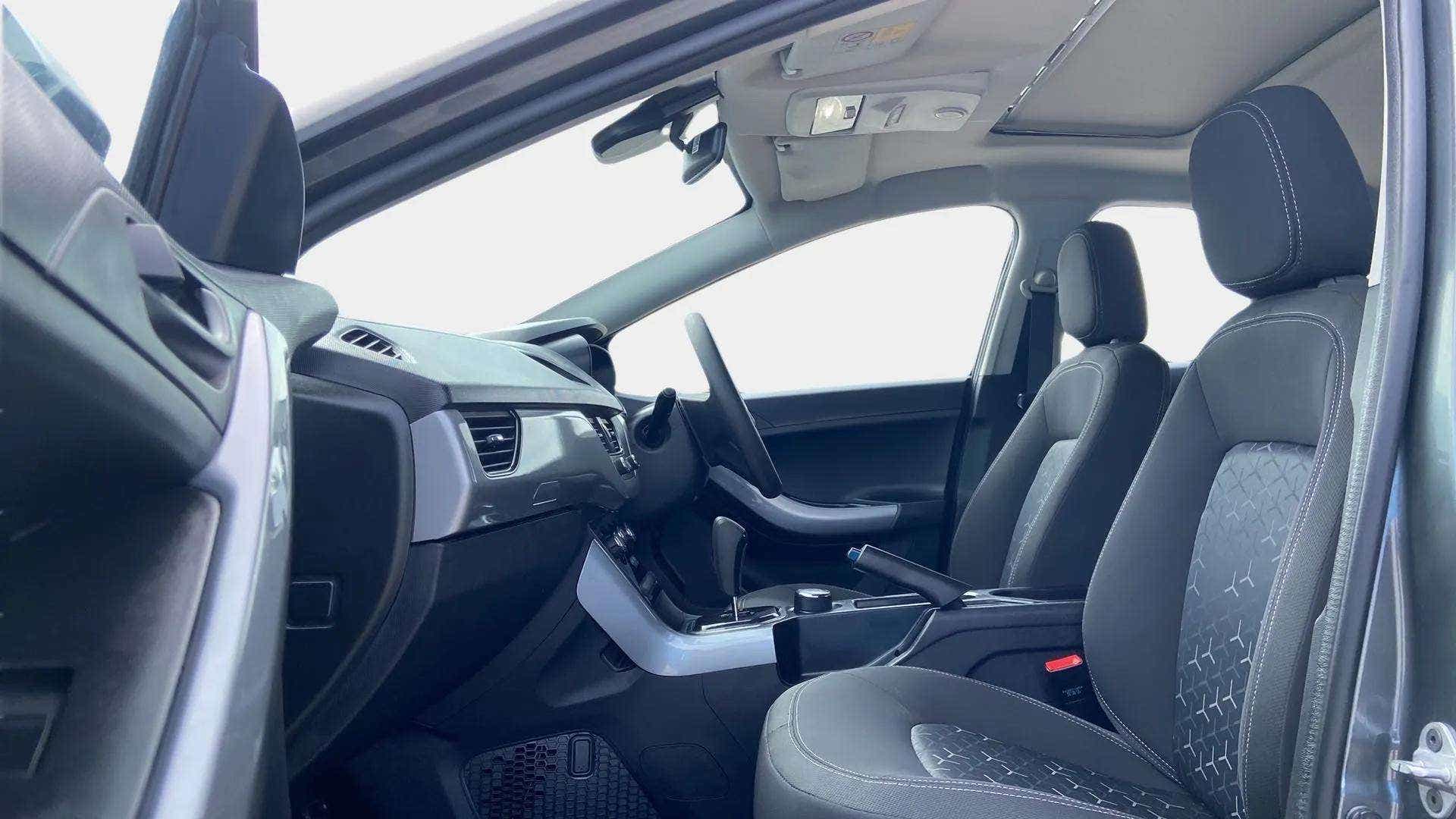 Interior front seats and dashboard of a Tata Nexon 2017-2023