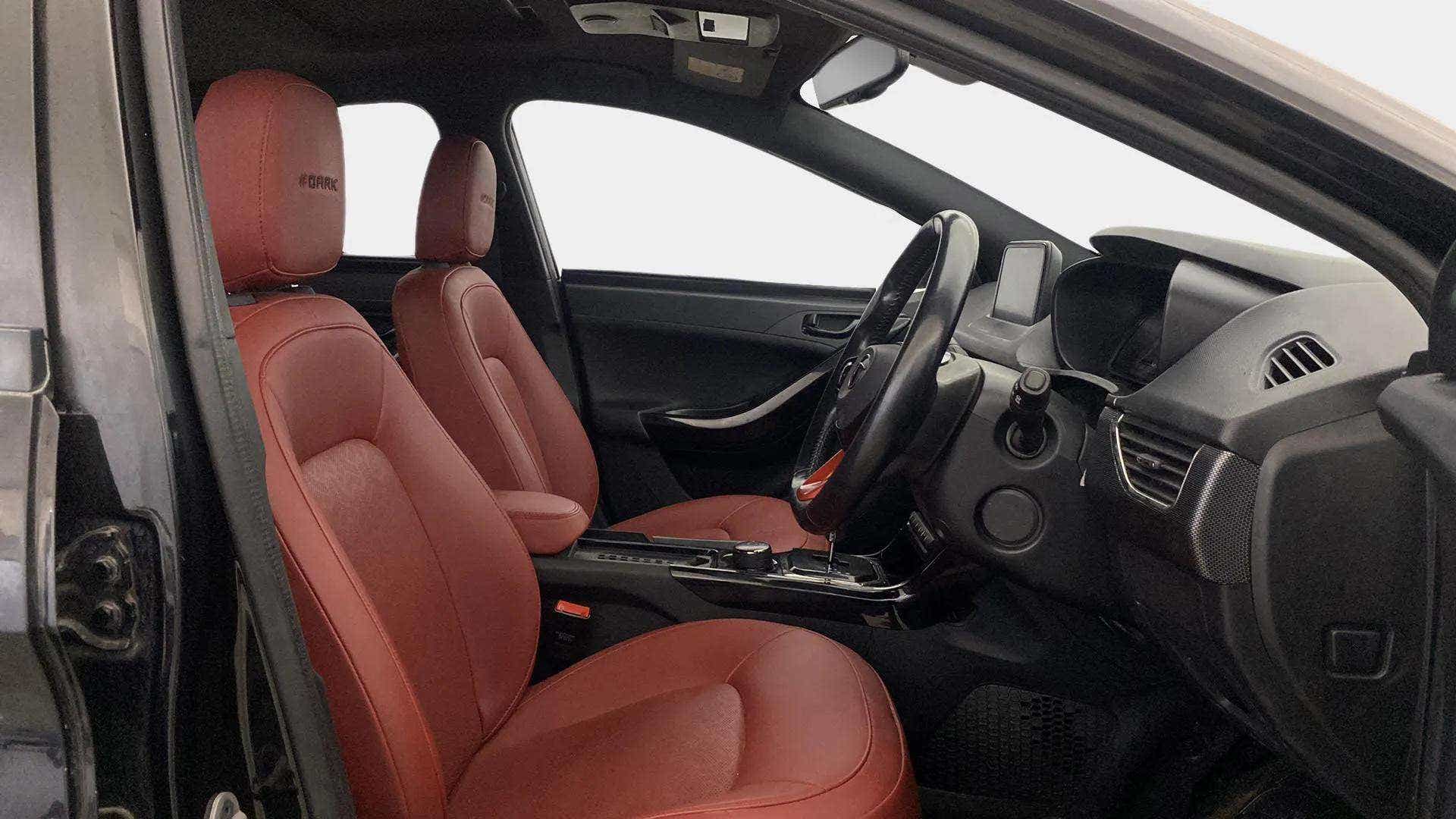 Interior front seats and dashboard of a Tata Nexon 2017-2023