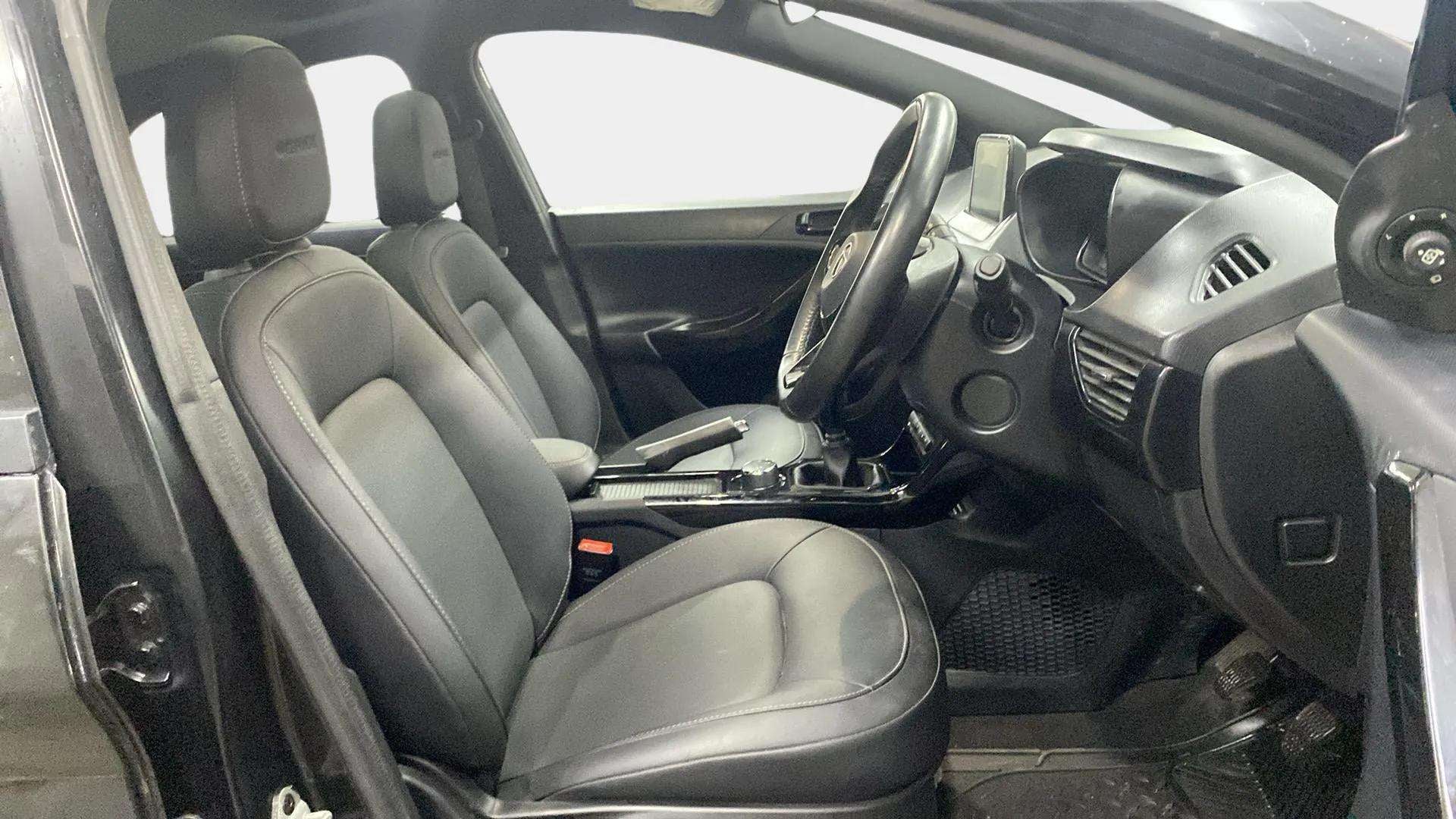 Interior front seats and dashboard of a Tata Nexon 2017-2023