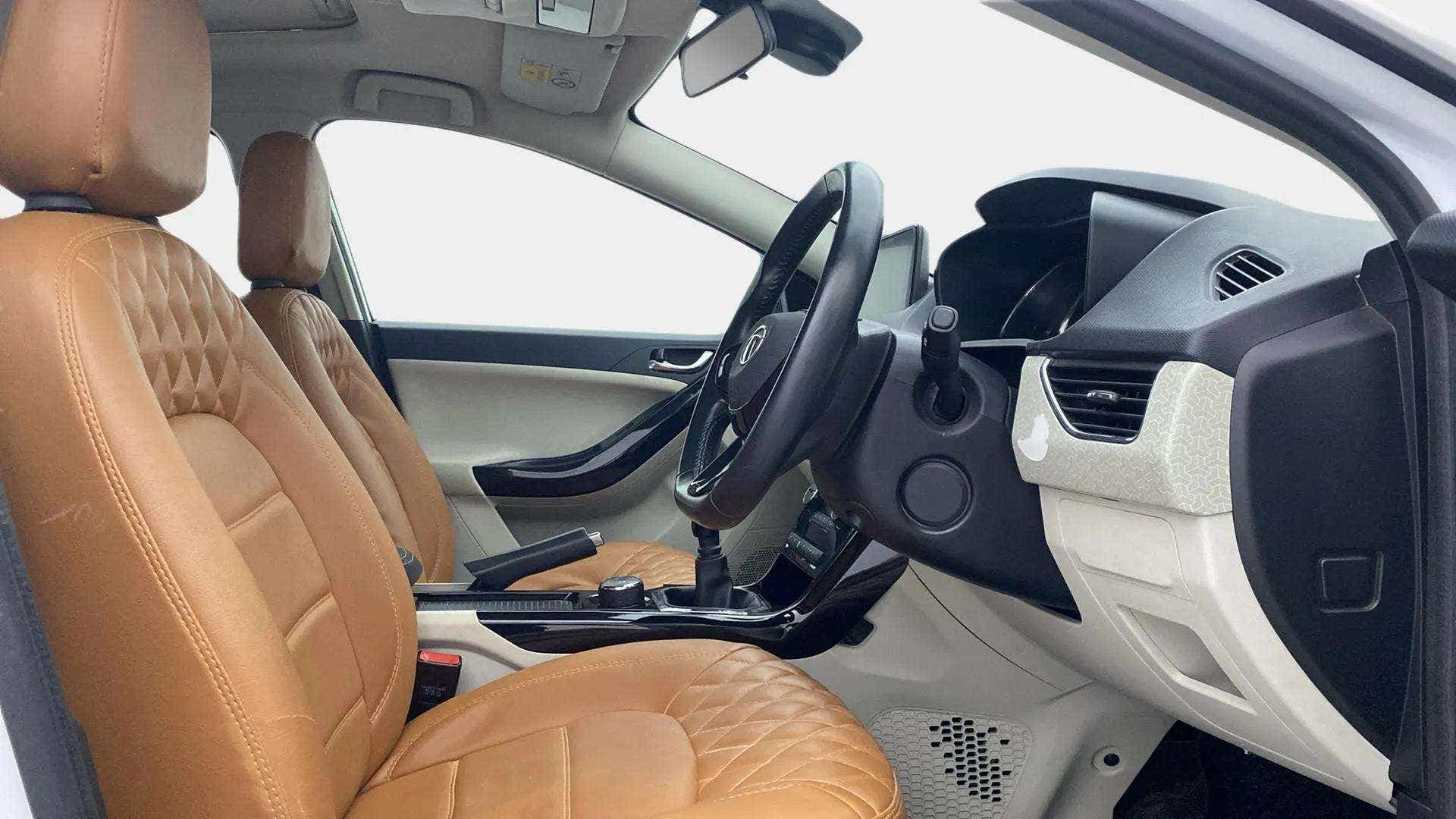 Interior front seats and dashboard of a Tata Nexon 2017-2023