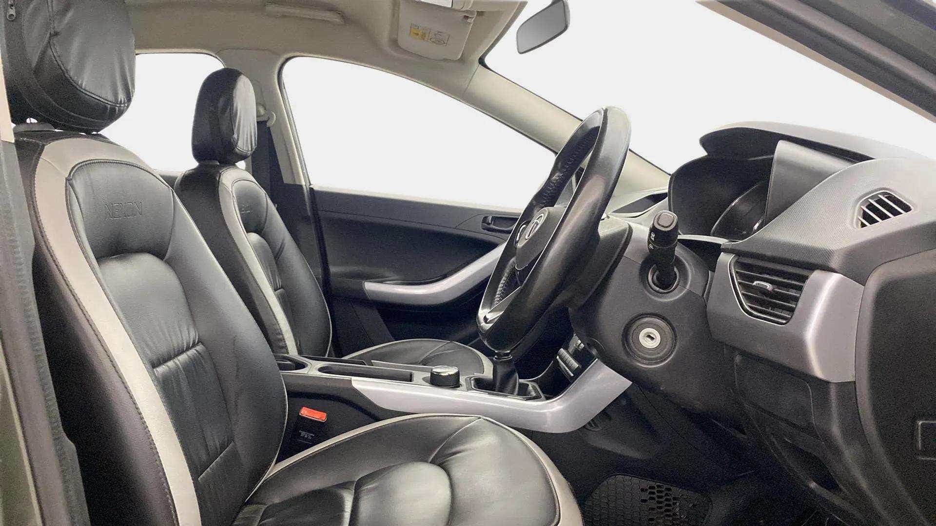 Interior dashboard and front seats of a Tata Nexon 2017-2023