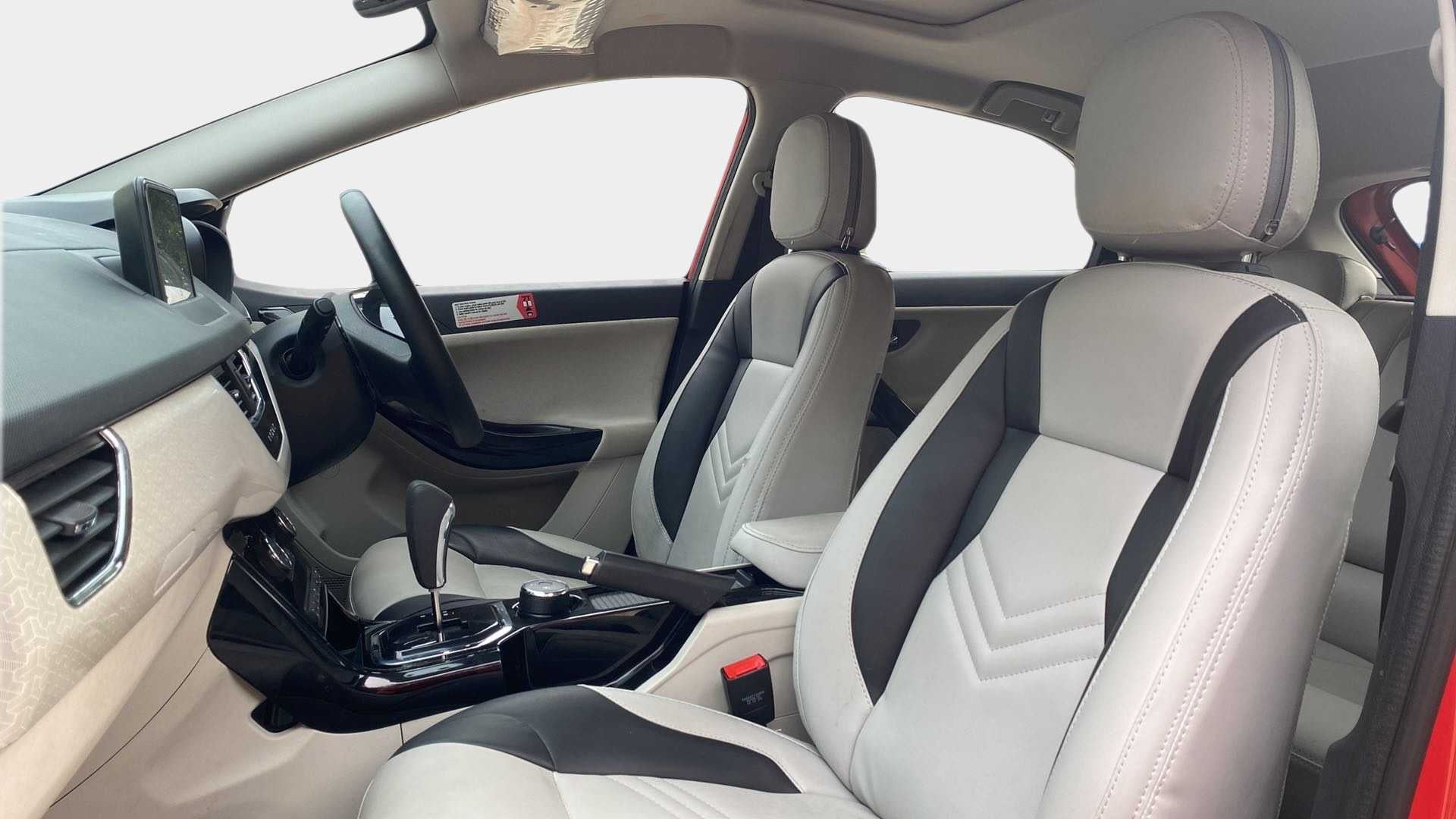 Front seats and dashboard view of a Tata Nexon 2017-2023