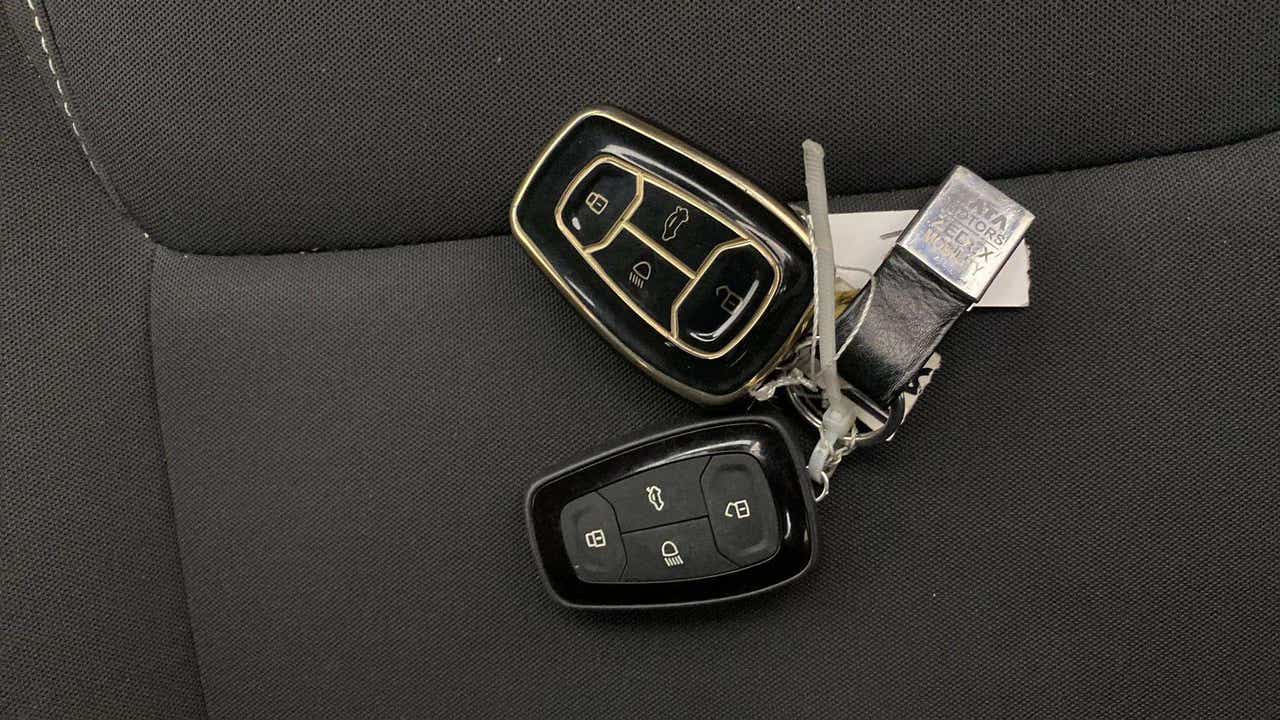 Car key fobs on a seat of a Tata Nexon