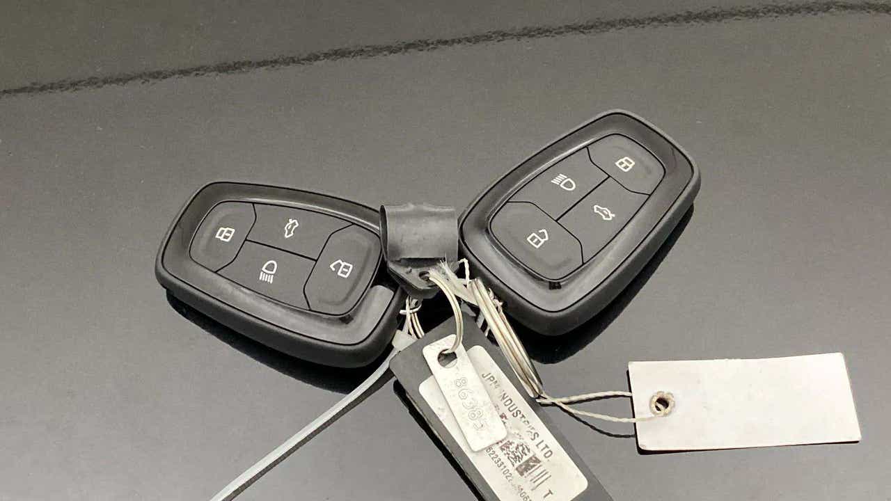 Car keys on the bonnet of a Tata Nexon 2017-2023