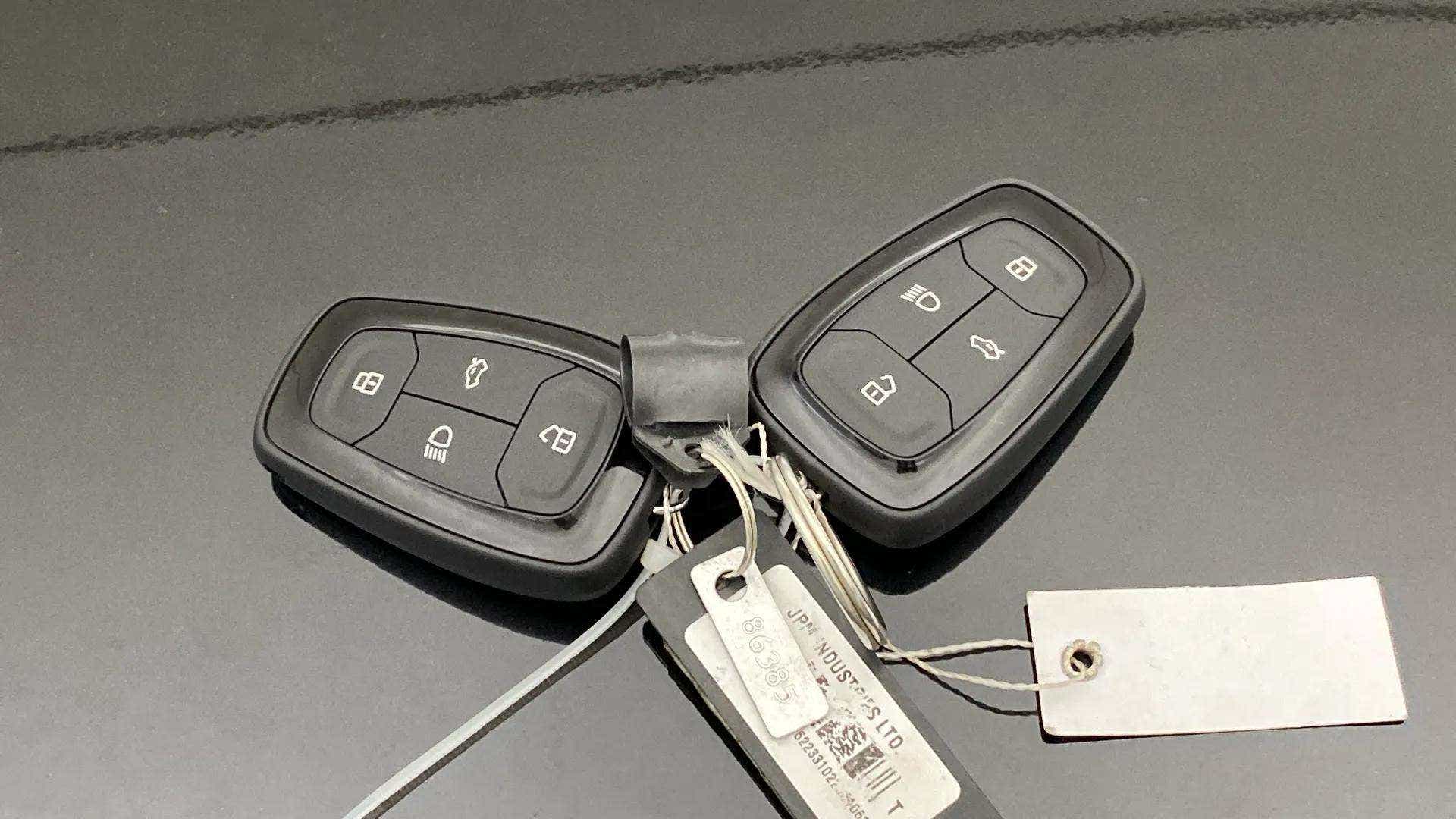 Car keys on the bonnet of a Tata Nexon 2017-2023