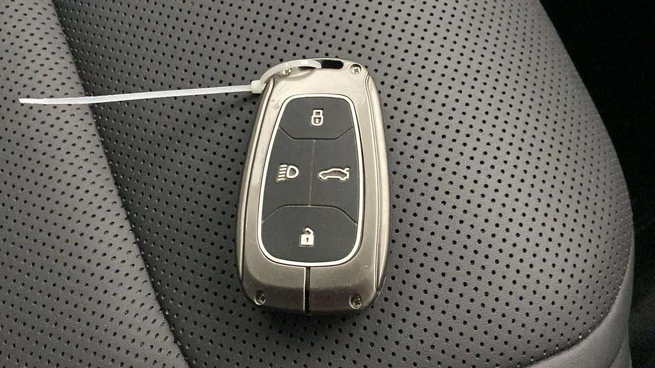 Car key fob on leather seat of a Tata Nexon