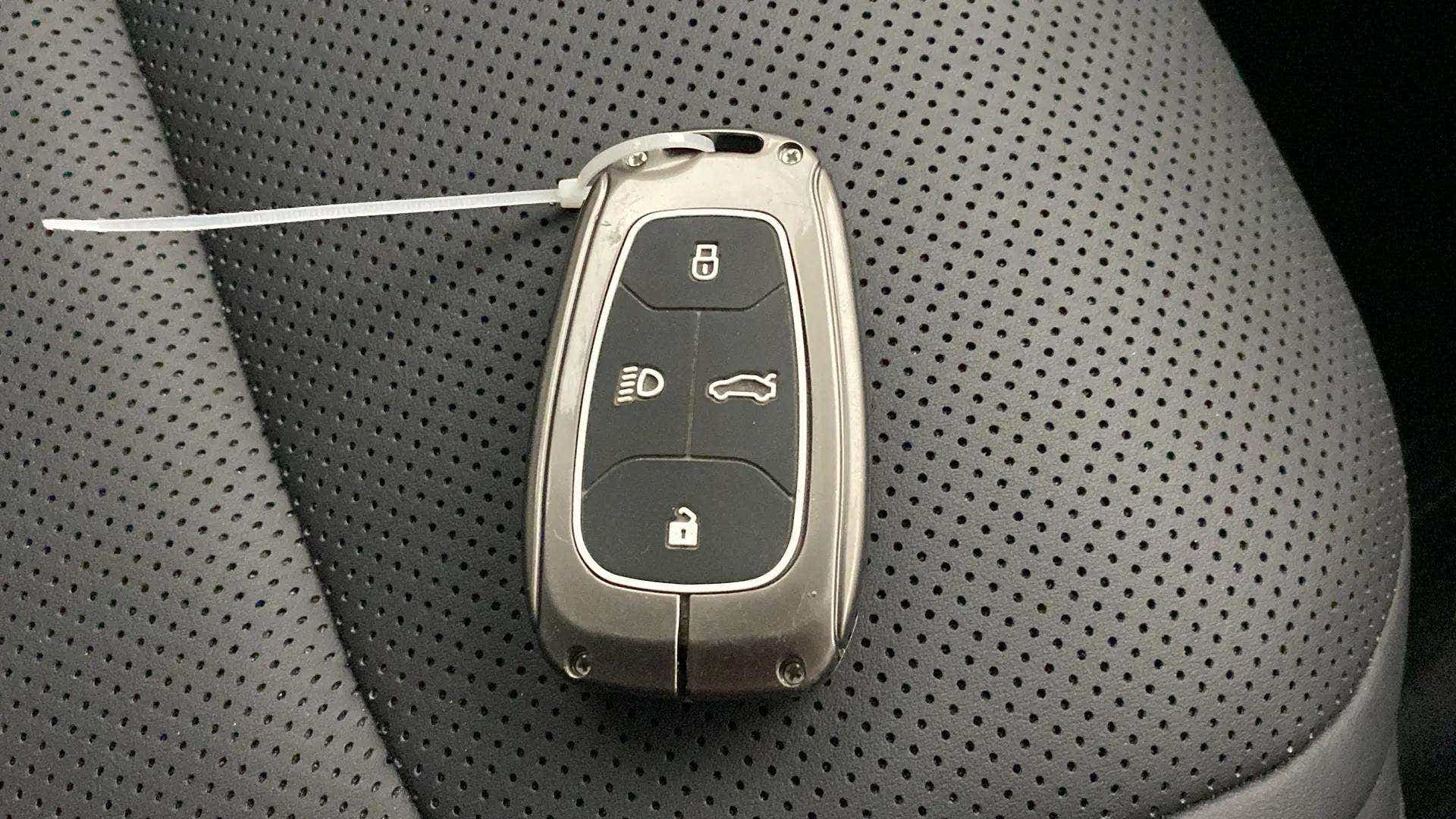 Car key fob on leather seat of a Tata Nexon