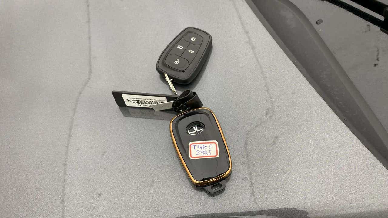 Car key fobs of a Tata Nexon on a surface