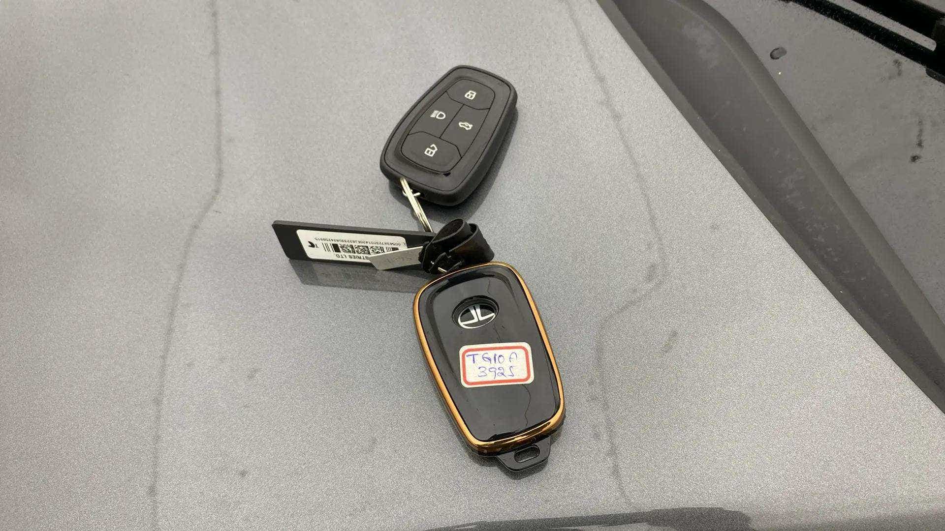 Car key fobs of a Tata Nexon on a surface