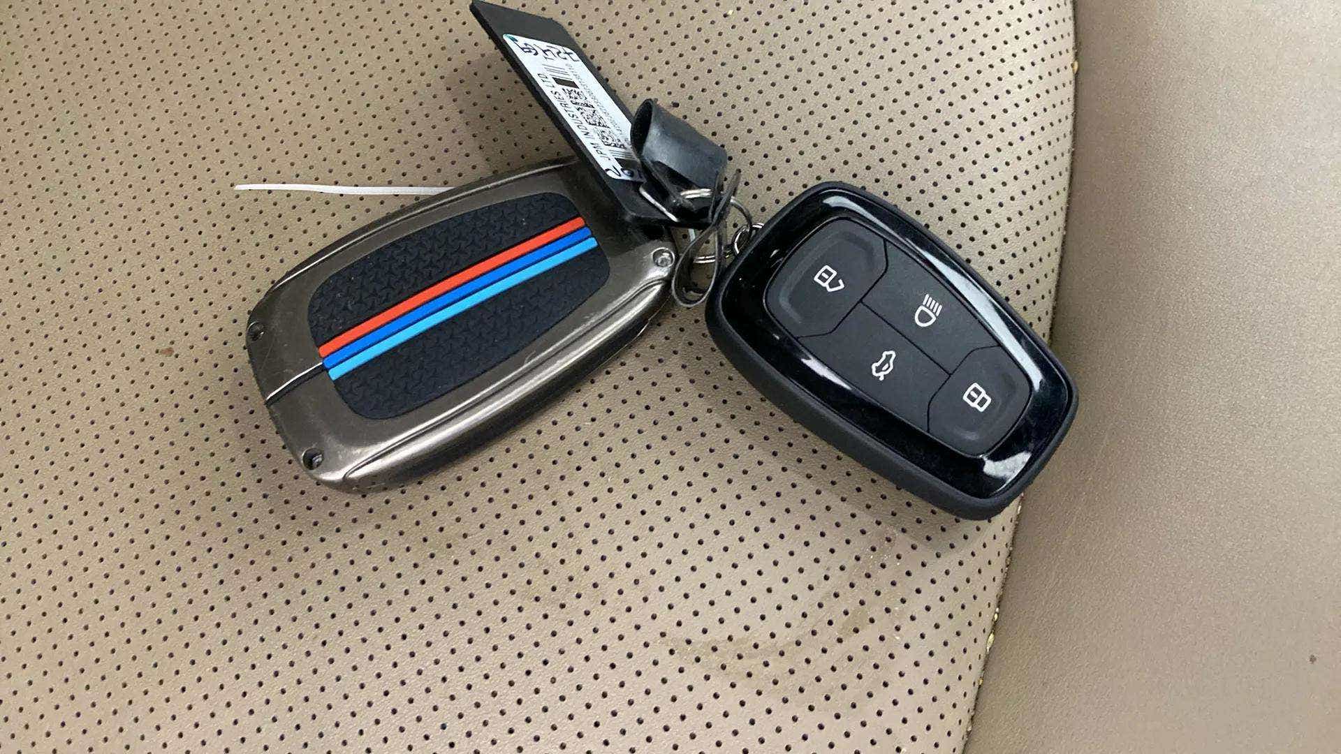Car key fobs on seat of a Tata Nexon 2017-2023