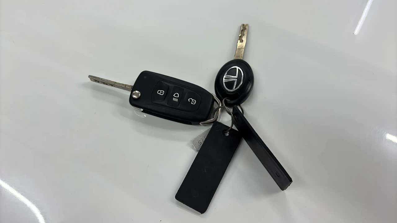 Close-up view of Tata Nexon car key fob on a white surface