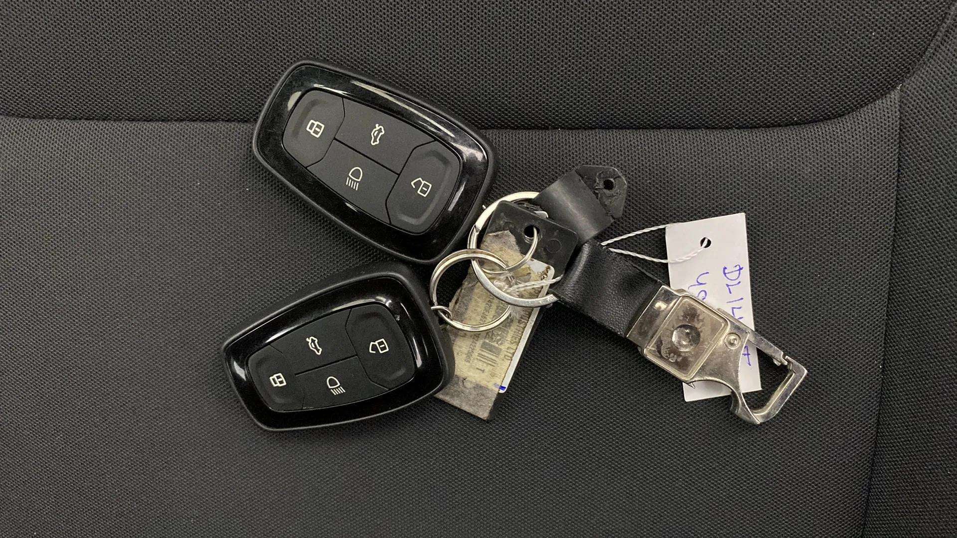 Car key fobs on a seat of a Tata Nexon