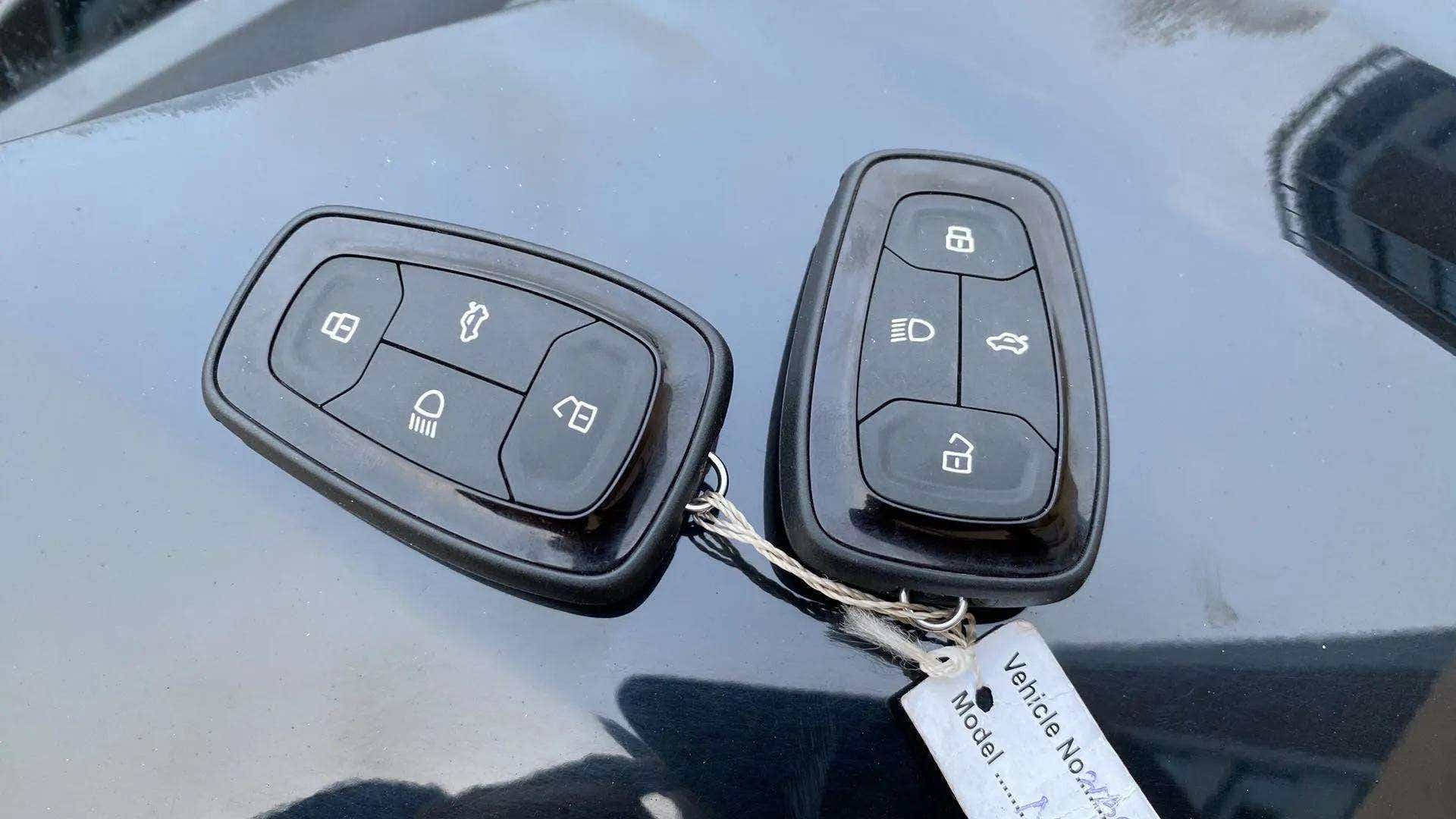 Key fobs on the hood of a Tata Nexon 2017-2023