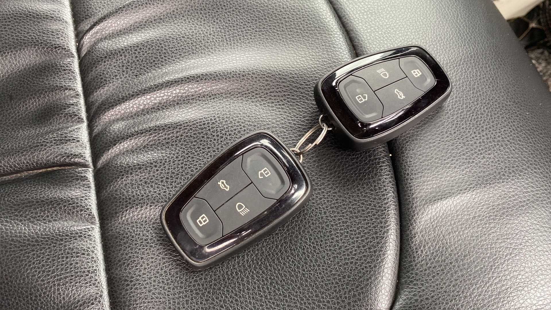 Car key fobs on a Tata Nexon 2017-2023 leather seat
